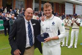 TOM HELM AWARDED COUNTY CAP